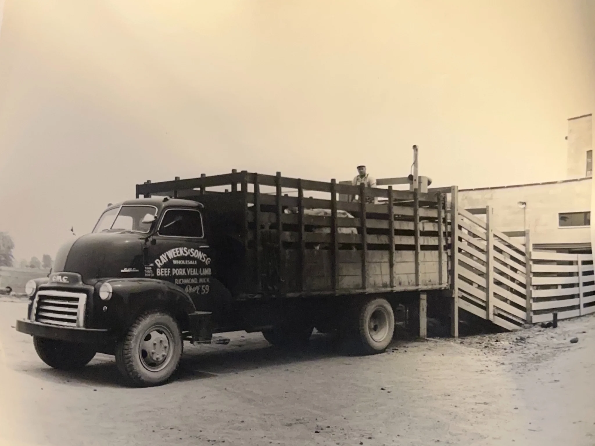Black and white photo of delivery truck