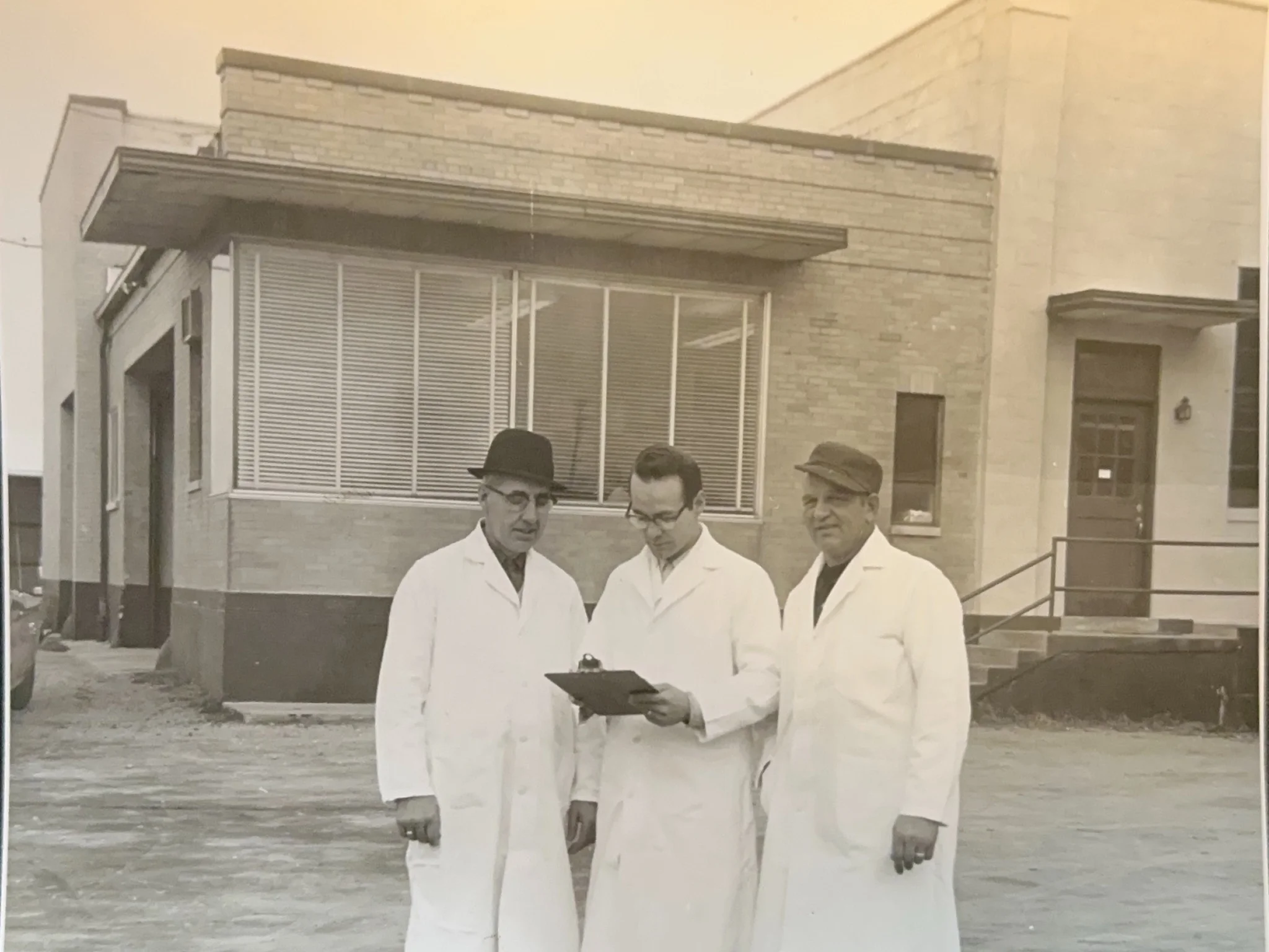 Black and white photo of Weeks Food employees outside the facility